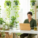 a-person-working-on-a-laptop-in-a-bright-green-hom